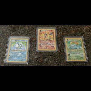Charizard, Blastoise, and Venusaur Base Set Holo Pokémon Cards.